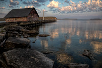 Water reflected sunrise over Anderson Boat House. WI