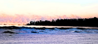 A panorama of Door County winter misty sunrise. Dramatic misty c