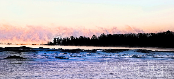A panorama of Door County winter misty sunrise. Dramatic misty c