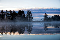 Misty morning sunrise on Bearskin Lake.Wisconsin.