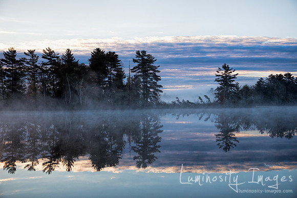 Misty morning sunrise on Bearskin Lake.Wisconsin.