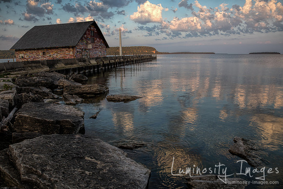 Water reflected sunrise over Anderson Boat House. WI
