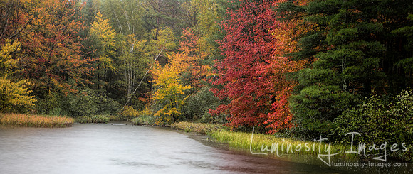 Panorama of misty fall colors on West Plum Lake, WI.
