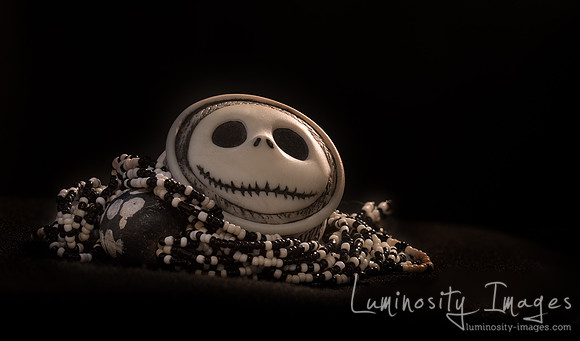 Halloween skull carved box on black and white beads.