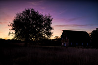 Purple and blue spectacular sunrise over barn. IL.